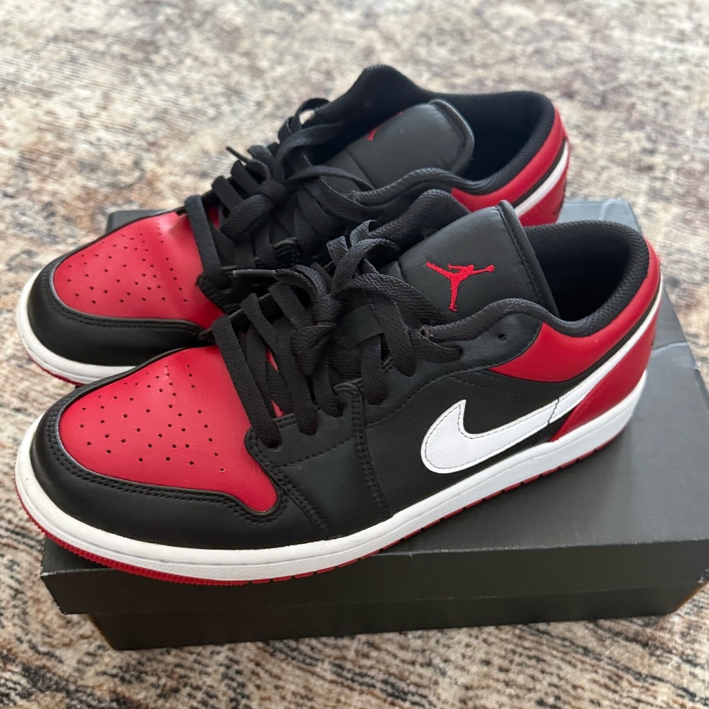 Air Jordan 1 Low Black/Red Sneakers with White Swoosh